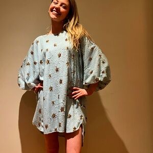 Pale blue sequined party dress with gold stars